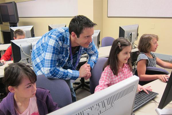 Students and a Teacher in a Computer Lab