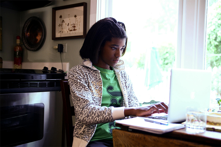 Young Student at Laptop